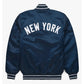 Back of satin NY Yankees varsity jacket featuring large team logo and striped ribbed hem