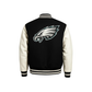 Black and white varsity jacket with a philadelphia eagles logo on a back side
