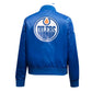 Back of NHL Edmonton Oilers satin varsity jacket in blue colour featuring large team logo and striped ribbed hem