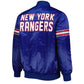 Back of NHL New Jersey Devils satin varsity jacket in blue colour featuring large team logo and striped ribbed hem