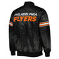 Back of NHL Philadelphia Flyers satin varsity jacket in black colour featuring large team logo and striped ribbed hem