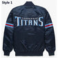 Back of Tennessee Titans satin varsity jacket featuring large team logo and striped ribbed hem

